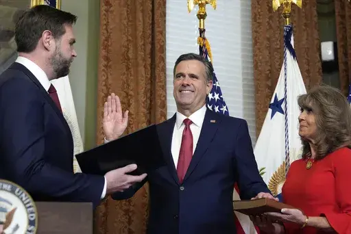 Vice President JD Vance swears in John Ratcliffe as CIA Director as his wife Michele holds the Bible in the Vice Presidential ceremonial office in the Eisenhower Executive Office Building on the White House campus, Thursday, Jan. 23, 2025, in Washington. (AP Photo/Alex Brandon)