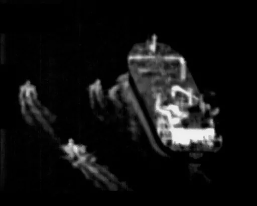 This still image taken from surveillance video from a U.S. Navy Boeing P-8 Poseidon shows three Iranian Revolutionary Guard fast-attack vessels near a commercial ship in the Strait of Hormuz Sunday, June 4, 2023. The U.S. Navy said Monday, June 5, its sailors and the United Kingdom Royal Navy came to the aid of a ship in the crucial Strait of Hormuz after Iran's Revolutionary Guard "harassed" it. Iran did not immediately acknowledge the incident. (U.S. Navy via AP)