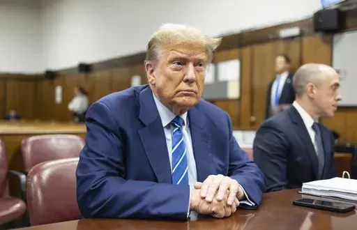 Former President Donald Trump awaits the start of proceedings on the second day of jury selection at Manhattan criminal court, April 16, 2024, in New York. (Justin Lane/Pool Photo via AP)