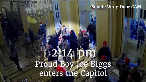 This image from video from a police worn body camera from the Jan. 6 riot at the U.S. Capitol, was played as a committee exhibit as the House select committee investigating the the Jan. 6 attack on the U.S. Capitol, held a hearing Thursday, June 9, 2022, on Capitol Hill in Washington. (House Select Committee via AP)