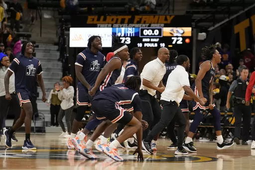 Members of Jackson State celebrate a 73-72 victory over Missouri following an NCAA college basketball game Sunday, Nov. 19, 2023, in Columbia, Mo. (AP Photo/Jeff Roberson)