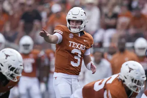 Texas quarterback Quinn Ewers (3) signals during the first half of an NCAA college football game against UTSA in Austin, Texas, Saturday, Sept. 14, 2024. (AP Photo/Eric Gay)