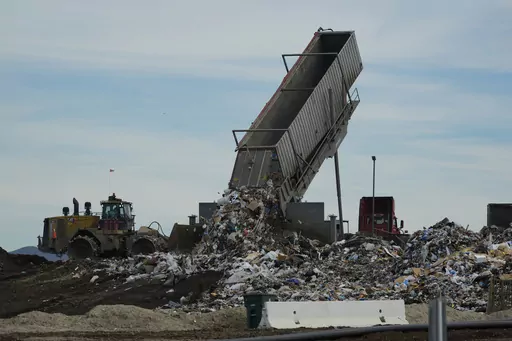 Trash is unloaded at the Otay Landfill in Chula Vista, Calif., on Friday, Jan. 26, 2024. Two years after California launched an effort to keep organic waste out of landfills, the state is so far behind on getting food recycling programs up and running that it's widely accepted next year's ambitious waste-reduction targets won't be met. Over time, food scraps and other organic materials like yard waste emit methane, a gas more potent and damaging in the short-term than carbon emissions from fossi