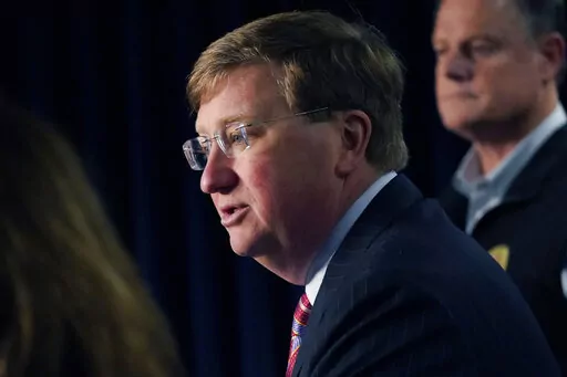 Mississippi Gov. Tate Reeves announces the state imposed boil-water notice has been lifted in Mississippi's capital city after nearly seven weeks, while Mississippi Emergency Management Agency executive director Stephen C. McCraney, right, listens, during a Sept. 15, 2022, news conference in Jackson. Repairs are still underway after problems at Jackson's main water treatment plant caused most customers to lose service for several days in late August and early September. Reeves blames Jackson's w