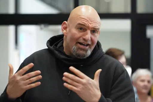 Pennsylvania Lt. Gov. John Fetterman visits with people attending a Democratic Party event for candidates to meet and collect signatures for ballot petitions for the upcoming Pennsylvania primary election, at the Steamfitters Technology Center in Harmony, Pa., March 4, 2022. The fate of the Democratic Party is intertwined in a pair of Pennsylvania elections that’ll be closely watched this year. John Fetterman could help the party keep control of the Senate. (AP Photo/Keith Srakocic, File)