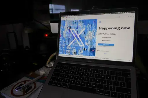 A view of a laptop shows the Twitter sign-in page with their logo, in Belgrade, Serbia, Monday, July 24, 2023. (AP Photo/Darko Vojinovic, File)
