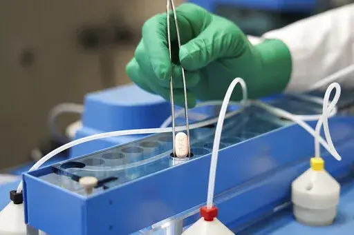 This image provided by Pfizer shows the company's COVID-19 Paxlovid pills. Pfizer's and Merck's COVID-19 pills that were supposed to be an important weapon against the pandemic in the U.S. are in short supply and have played little role in the fight against the omicron wave of infections. (Pfizer via AP, File)