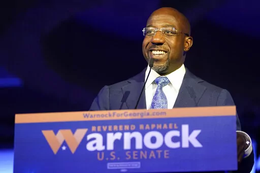 Democratic Sen. Raphael Warnock speaks during an election night watch party on Tuesday, Nov. 8, 2022, in Atlanta. (AP Photo/John Bazemore)