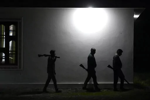 Village Defense Group members patrol during night at Muradpur village in Rajouri, India, Feb. 8, 2023. Days after seven Hindus were killed in the village in disputed Kashmir, hundreds of residents staged protests across the region's Hindu-dominated areas. In response, Indian authorities revived a government-sponsored militia and began rearming and training villagers. The militia, officially called the “Village Defense Group,” was initially formed in the 1990s as the first line of defense aga