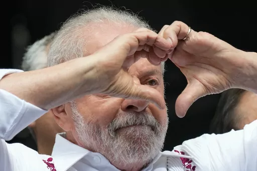 Brazilian President Luiz Inacio Lula da Silva flashes a heart-hand sign at supporters during a rally in Sao Paulo, Brazil, May 1, 2023. Lula likes to boast he had a good first year returning to the job. The economy is improving, Congress passed a long overdue tax reform package, rioters who wanted to oust him are now in jail and his predecessor and foe Jair Bolsonaro is barred from running for office until 2030. (AP Photo/Andre Penner, File)