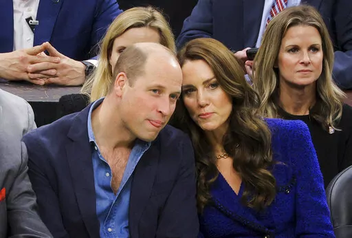 Britain's Prince William and Kate, Princess of Wales, watch the NBA basketball game between the Boston Celtics and the Miami Heat on Wednesday, Nov. 30, 2022, in Boston. (Brian Snyder/Pool Photo via AP)