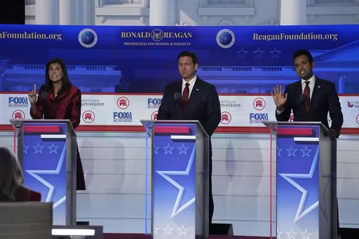 Former U.N. Ambassador Nikki Haley, left, argues a point with businessman Vivek Ramaswamy, right, between Florida Gov. Ron DeSantis, center, during a Republican presidential primary debate hosted by FOX Business Network and Univision, Wednesday, Sept. 27, 2023, at the Ronald Reagan Presidential Library in Simi Valley, Calif. (AP Photo/Mark J. Terrill, File)
