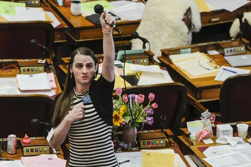 Montana state Rep. Zooey Zephyr, D-Missoula, alone on the House floor stands in protest as demonstrators are arrested in the House gallery, Monday, April 24, 2023, at the state Capitol in Helena, Mont. Montana's Republican Gov. Greg Gianforte signed a bill Friday, April 28, to ban gender-affirming medical care for young transgender people — the battle over which ended with the removal of a transgender lawmaker from the House floor. (Thom Bridge/Independent Record via AP, File)