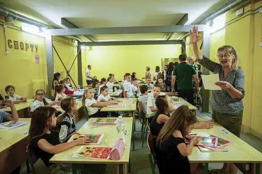 Classes continue underground at Gymnasium No. 6 despite an air alert in Zaporizhzhia, Ukraine, Sept. 3, 2024. Missiles and bombs strike daily, so the city has begun on a dozen subterranean schools designed to be radiation- and bomb-proof. (AP Photo/Evgeniy Maloletka)