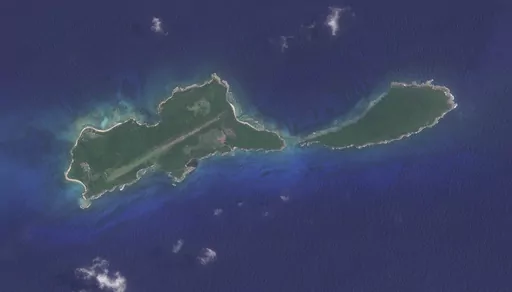 This image provided by Planet Labs PBC shows Great Swan Island or the Islas del Cisne in Honduras, on July 13, 2023. Honduras says it will build a maximum security prison on this tiny island off its Caribbean coast to contain the leaders of the country’s most fearsome gangs. (Planet Labs PBC via AP)