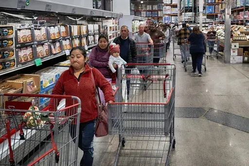 Customers wait in line for eggs at a Costco store in the Van Nuys section of Los Angeles on Wednesday, Feb. 19, 2025. (AP Photo/Richard Vogel, File)