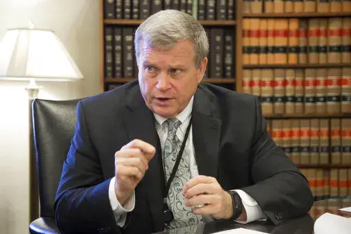 In this March 1, 2017, file photo, Idaho Attorney General Lawrence Wasden speaks during an interview in Boise, Idaho. The false claims that the 2020 election was stolen from former President Donald Trump and protecting future election results loom large over this year’s races for state attorneys general. Candidates who support Trump’s position are angling to unseat Democratic incumbents in political swing states – and in some cases, knock out moderate attorneys general in GOP primaries. (D