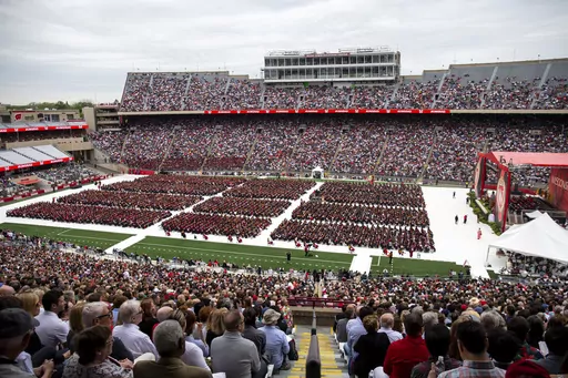 Attendees watch the 170th University of Wisconsin-Madison commencement ceremony at Camp Randall Stadium in Madison, Wis., on May 13, 2023. Republican lawmakers were poised Tuesday, June 13, to cut funding for University of Wisconsin campuses as the GOP-controlled state Legislature and school officials continue to clash over efforts to promote diversity and inclusion. (Samantha Madar/Wisconsin State Journal via AP, File)