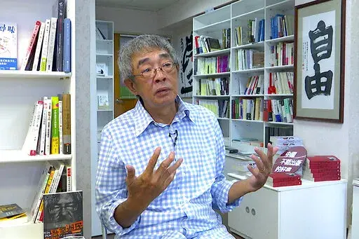 Lam Wing-Kee, a Hong Kong bookstore owner who fled to Taiwan in 2019, speaks during an interview inside his bookstore in Taipei, Taiwan on June 8, 2022. Taiwan just 400 miles from Hong Kong, is close not just geographically, but also linguistically and culturally. It offered the freedoms that many Hong Kongers were used to and saw disappearing in their hometown. (AP Photo/Johnson Lai)
