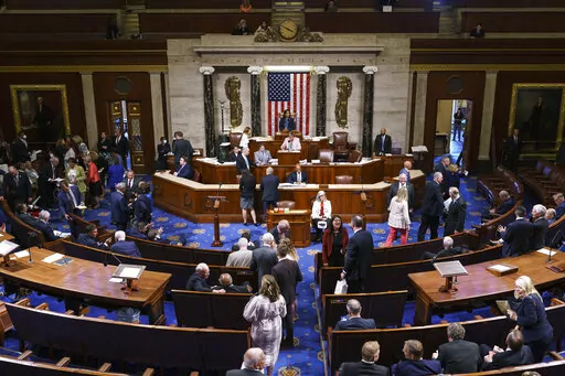 FILE - Members of the House of Representatives gather in the chamber to vote on creation of a select committee to investigate the Jan. 6 Capitol insurrection, at the Capitol in Washington, on June 30, 2021. (AP Photo/J. Scott Applewhite, File)
