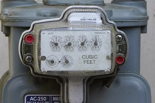 A gas meters keep tabs on usage at this Jackson, Miss., residence, Feb. 22, 2022. With energy prices rising and summer heat looming, it’s a good time to make sure your home is running as efficiently as possible. (AP Photo/Rogelio V. Solis, File)