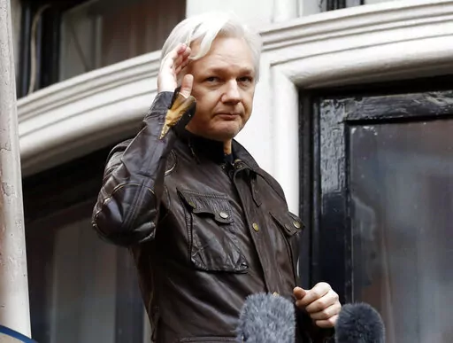 WikiLeaks founder Julian Assange greets supporters from a balcony of the Ecuadorian embassy in London, May 19, 2017. Britain’s top court on Monday March 14, 2022, refused WikiLeaks founder Julian Assange permission to appeal against a decision to extradite him to the U.S. to face spying charges. (AP Photo/Frank Augstein, File)