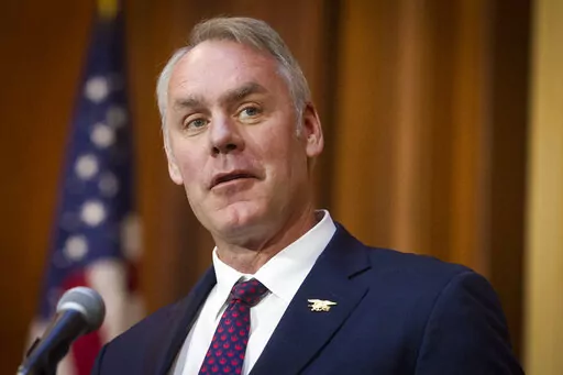 In this Dec. 11, 2018 file photo, then-Secretary of the Interior Ryan Zinke speaks at EPA headquarters in Washington. Government investigators say Zinke misused his position to advance a development project in his Montana hometown and lied to an agency ethics official about his involvement. The Interior Department's inspector general said in a report made public Wednesday, Feb. 16, 2022, that Zinke continued working with a foundation on the commercial project in the community of Whitefish, Monta