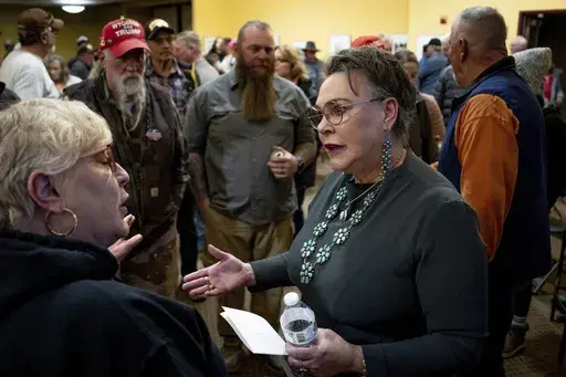 Rep. Harriet Hageman, R-Wyo., talks to attendees after holding a town hall meeting on Friday, March 14, 2025, in Evanston, Wyo. (AP Photo/Spenser Heaps)