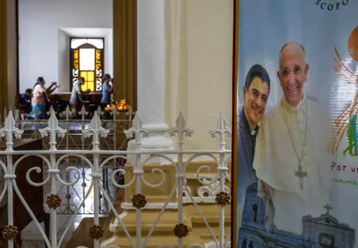 A poster featuring Bishop Rolando Alvarez and Pope Francis hangs inside the Cathedral in Matagalpa, Nicaragua, Aug. 19, 2022. Five Catholic priests were sentenced to 10 years in prison in Managua, on Monday, Feb. 6, 2023, accused of "conspiracy", including four who worked alongside the also detained bishop of the diocese of Matagalpa, Rolando Alvarez. (AP Photo/Inti Ocon, File)