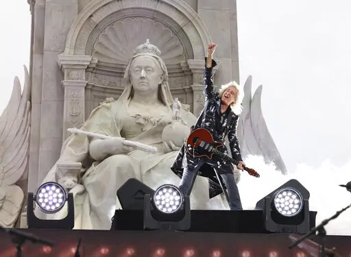 Queen guitarist Brian May performs during the Platinum Jubilee concert taking place in front of Buckingham Palace, London June 4, 2022. May, who is also an animal welfare campaigner, was appointed a knight bachelor for his services to music and charity New Year’s Honors list on Friday, Dec. 30, 2022, the first to be signed off by Britain's King Charles III. (Jonathan Buckmaster/Pool Photo via AP, file)