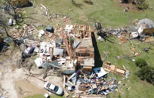 A home is destroyed from a possible tornado the next before near Andover, Kan., on Saturday, April 30, 2022  A suspected tornado that barreled through parts of Kansas has damaged multiple buildings, injured several people and left more than 6,500 people without power. (Jaime Green/The Wichita Eagle via AP)