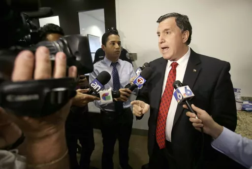 Former Doral, Fla., City Manager Joe Carollo, gestures as he talks to members of the media after being fired by the City Council on April 28, 2014 in Doral. A federal jury in South Florida awarded $63.5 million on Thursday, June 1, 2023, to a pair of businessmen who claimed Miami City Commissioner Carollo used his office to harass them after they supported the commissioner's political opponent. (AP Photo, File)