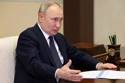 Russian President Vladimir Putin gestures while speaking to the Governor of the Nizhny Novgorod Region, Gleb Nikitin, during their meeting at the Novo-Ogaryovo residence outside Moscow, Russia, Wednesday, May 3, 2023. (Mikhail Klimentyev, Sputnik, Kremlin Pool Photo via AP)