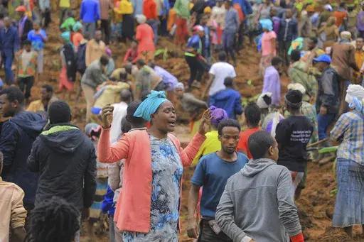 ADDS NAME OF THE PHOTOGRAPHER- In this handout photo released by Gofa Zone Government Communication Affairs Department, a woman cries as hundreds of people gather at the site of a mudslide in the Kencho Shacha Gozdi district, Gofa Zone, southern Ethiopia, Monday, July 22, 2024. At least 146 people were killed in mudslides in a remote part of Ethiopia that has been hit with heavy rainfall, according to local authorities. (Isayas Churga/Gofa Zone Government Communication Affairs Department via AP)