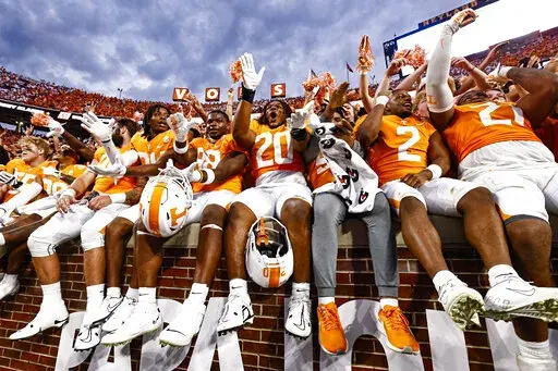 Tennessee running back Jaylen Wright (20) and teammates celebrates a 38-33 win after an NCAA college football game against Florida, Saturday, Sept. 24, 2022, in Knoxville, Tenn. (AP Photo/Wade Payne, File)