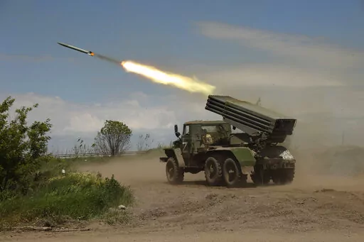A Donetsk People's Republic militia's multiple rocket launcher fires from its position not far from Panteleimonivka, in territory under the government of the Donetsk People's Republic, eastern Ukraine, Saturday, May 28, 2022. Day after day, Russia is pounding the Donbas region of Ukraine with relentless artillery and air raids, making slow but steady progress to seize the industrial heartland of its neighbor. With the conflict now in its fourth month, it’s a high-stakes campaign that could dic