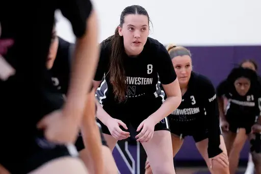 Northwestern freshman Kat Righeimer, one of six women from Kobe Bryant’s Mamba Academy going through their first experience with college basketball, warms up with teammates during NCAA college basketball practice in Evanston, Ill., Tuesday, Feb. 25, 2025. (AP Photo/Nam Y. Huh)