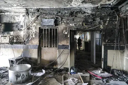 This photo released by Mizan News Agency, shows a workshop of Evin prison following a fire in Tehran, Iran, Sunday, Oct. 16, 2022. A towering blaze at the prison housing political prisoners and anti-government activists killed four inmates, the country's judiciary said. (Koosha Mahshid Falahi/Mizan News Agency via AP)