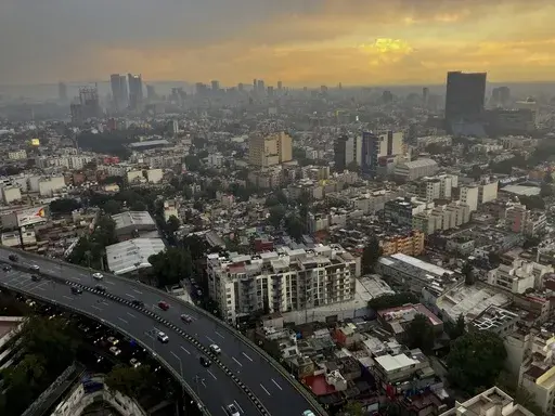 The sun sets in Mexico City after heavy rain, July 25, 2024. (AP Photo/Marco Ugarte, File)