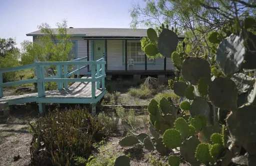 The home of the late Amada Cardenas, who was one of the first federally licensed peyote dealers, alongside her husband, to harvest and sell the sacramental plant to followers of the Native American Church, Monday, March 25, 2024, in Mirando City, Texas. (AP Photo/Jessie Wardarski)