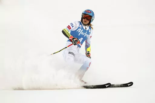 United States' Mikaela Shiffrin checks her time at the finish area of an alpine ski, women's World Cup giant slalom, in Kronplatz, Italy, Jan. 25, 2022. Empathizing with other athletes’ frank conversations about mental health got Shiffrin thinking about what awaits her at the Beijing Olympics. (AP Photo/Gabriele Facciotti, File)