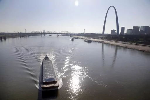 A barge powers its way up the Mississippi River on Nov. 16, 2012, in St. Louis. Parts of the Mississippi River are so low from weeks of drought that barge traffic is being limited at the worst possible time: as crop harvests begin in 2022. (AP Photo/Jeff Roberson, File)