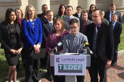Connor Thonen-Fleck addresses reporters while his parents stand by his side, March 11, 2019, in Durham, N.C. West Virginia and North Carolina's refusal to cover certain health care for transgender people with government-sponsored insurance is discriminatory, a federal appeals court ruled Monday, April 29, 2024 in a case likely headed to the U.S. Supreme Court. (AP Photo/ Jonathan Drew, FIle)