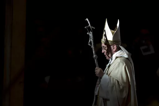 Pope Francis holds the pastoral staff as he leaves after celebrating a Mass in St. Peter's Basilica, at the Vatican, to mark Epiphany, Jan. 6, 2014. Pope Francis celebrates the 10th anniversary of his election Monday, March 13, 2023, far outpacing the "two or three" years he once envisioned for his papacy and showing no signs of slowing down. (AP Photo/Andrew Medichini, File)