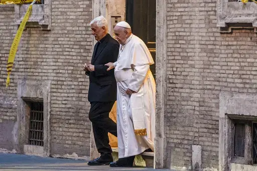 Pope Francis is flanked by Jesuits' superior general Arturo Sosa Abascal, left, after presiding a mass on March 12, 2022. Pope Francis’ Jesuit religious order said Thursday, June 15, 2023 it has expelled a prominent Slovenian priest from the congregation following allegations of sexual, spiritual and psychological abuses against adult women. (AP Photo/Domenico Stinellis, File)