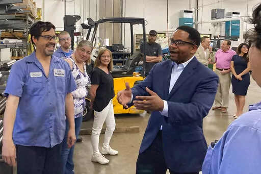 Republican candidate for Illinois governor Richard Irvin speaks with employees during a tour of HM Manufacturing Inc. in Wauconda, Ill., June 21, 2022. Irvin is seeking the Republican nomination to face Democratic Gov. J.B. Pritzker in November. (AP Photo/Sara Burnett, File)
