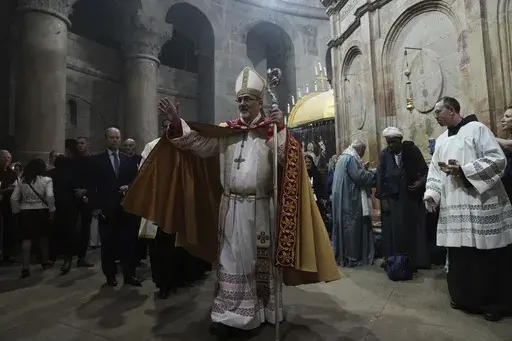 Latin Patriarch of Jerusalem Pierbattista Pizzaballa leads the Easter Sunday Mass at the Church of the Holy Sepulcher, where many Christians believe Jesus was crucified, buried and rose from the dead, in the Old City of Jerusalem, Sunday, April 9, 2023. Since the rise of Israel's most right-wing government in history, church leaders say the 2,000-year-old Christian community in Jerusalem has come under increasing attack, with an uptick in harassment of clergy and vandalism of religious propertie