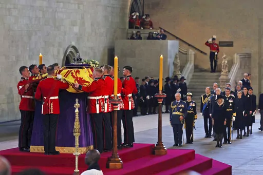 The coffin of Queen Elizabeth II is placed in Westminster Hall at the Palace of Westminster for the lying in state, in London, Wednesday, Sept. 14, 2022. (Dan Kitwood/Pool via AP)