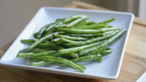 A plate of sauteed green beans is displayed in Lincoln, Neb., on Oct. 16, 2024. (Amber Pankonin via AP)