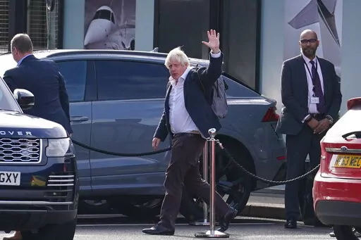 Former Prime Minister Boris Johnson arrives at Gatwick Airport in London, after travelling on a flight from the Caribbean, following the resignation of Liz Truss as Prime Minister, Oct. 22, 2022. Boris Johnson said Sunday Oct. 23, 2022 he will not run to lead UK Conservative Party, quashing comeback speculation. (Gareth Fuller/PA via AP, File)